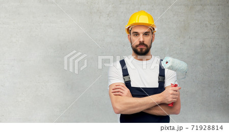 male worker or builder with paint roller 71928814