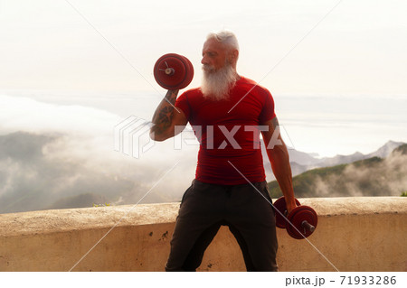 Senior man doing sport exercises Senior man doing sport exercises 71933286