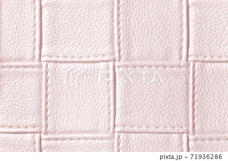 Texture of light pink leather background with square pattern and stitch, macro. Texture of light pink leather background with square pattern and stitch, macro. 71936286