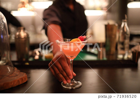 cocktails in glasses on bar counter in pup or restaurant cocktails in glasses on bar counter in pup or restaurant 71936520