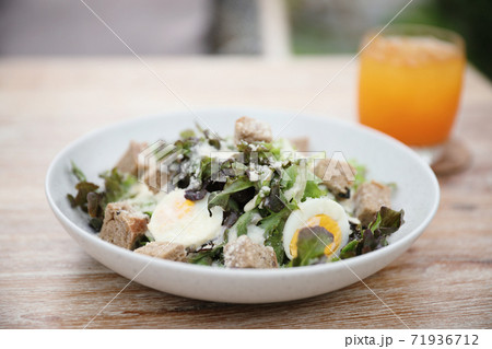 caesar salad appetizer on wooden background 71936712