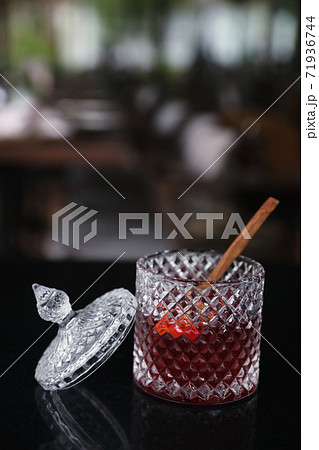 Pink Cocktail glass with ice at a bar counter Pink Cocktail glass with ice at a bar counter 71936744