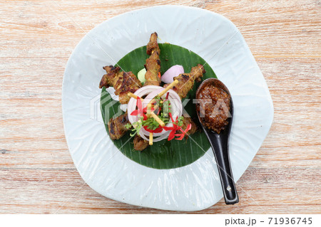 Chicken Satay on dark brown table street food appetizer 71936745