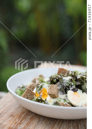 caesar salad appetizer on wooden background caesar salad appetizer on wooden background 71936957