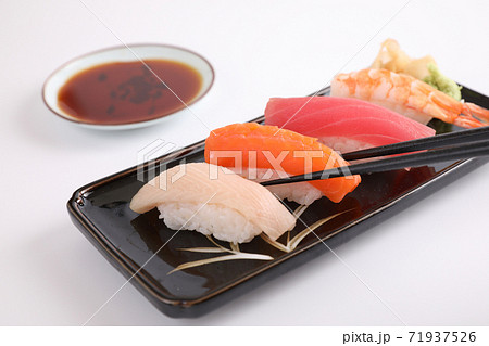Sushi set , Japanese food sushi salmon tuna shrimp  and sea bass with chopsticks isolated in white background 71937526