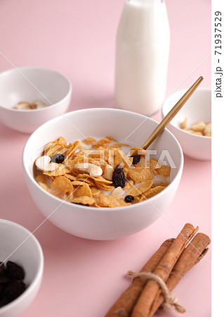 Cereal dessert with corn oat and dry fruits isolated in pink background 71937529
