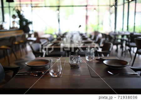 Table set with silverware dish and glass in restaurant Table set with silverware dish and glass in restaurant 71938036