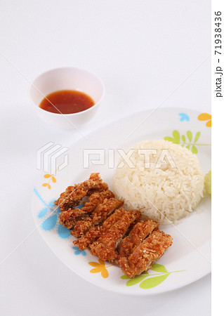 Thai food gourmet fried chicken with rice , khao mun kai in wood background Thai food gourmet fried chicken with rice , khao mun kai in wood background 71938436