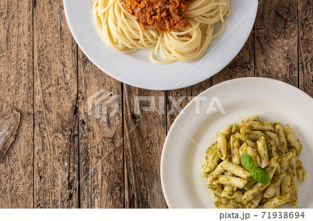 Penne pasta and spaghetti with bolognese sauce dishes 71938694