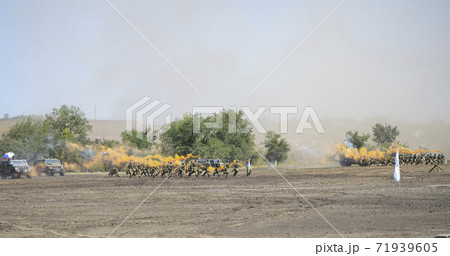 Rostov-on-Don, Russia - August 27, 2020 : Marines with smoke bombs and using amphibious car in the attack 71939605