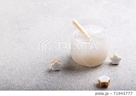 Glass of fresh cold lychee juice with ice 71943777