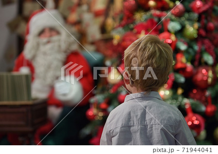 A Boy with Cochlear Implants and Santa Claus 71944041