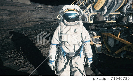 An astronaut stands beside his lunar rover at the space moon base. View of the lunar surface and lunar colony. 3D Rendering. 71946789