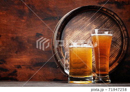 Mug and glass of light lager beer and wooden barrel Mug and glass of light lager beer and wooden barrel 71947258