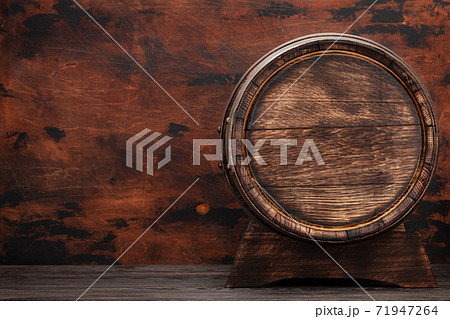 Old wooden barrel for wine or whiskey aging 71947264