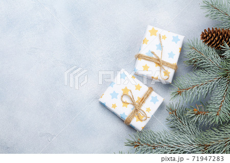 Christmas card with fir tree and gift boxes 71947283