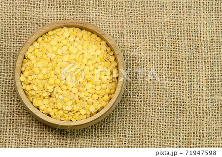 Yellow Lentils, wooden cup Yellow Lentils, wooden cup 71947598