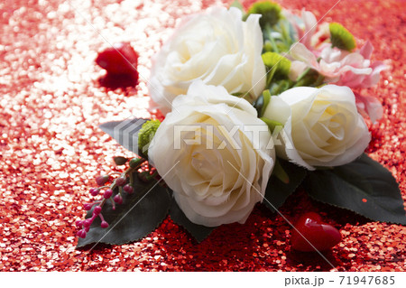 Valentine Day abstract background with white roses and red hearts over red background with copy space 71947685