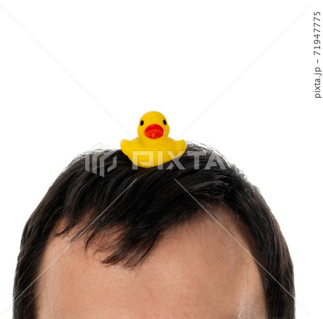 Yellow inflatable duck on head symbol of the Thai protests 71947775