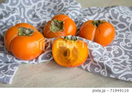 Fresh ripe persimmon, persimmon. Vitamins in the winter 71949110
