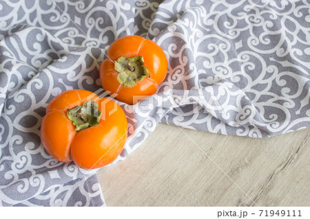 Fresh ripe persimmon, persimmon. Vitamins in the winter 71949111
