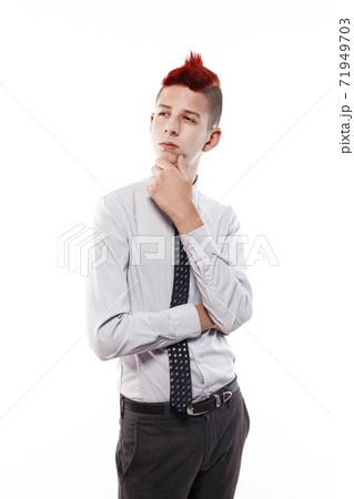 Portrait of serious teen with red mohawk wearing shirt and tie while looking at camera. Isolated. 71949703