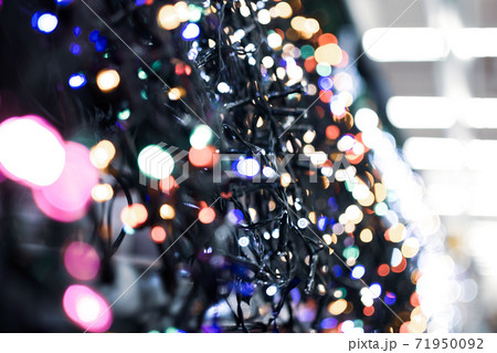 Christmas light garlands in the supermarket, blurred photo Christmas light garlands in the supermarket, blurred photo 71950092