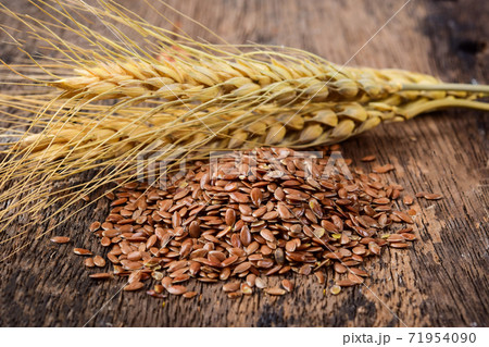 Fax seeds isolated on wooden Fax seeds isolated on wooden 71954090