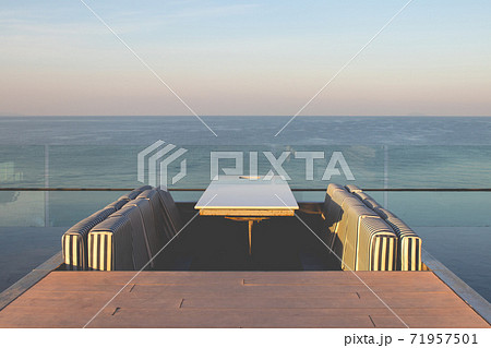 Tropical view of outdoor rooftop of building with seascape view. Tropical view of outdoor rooftop of building with seascape view. 71957501