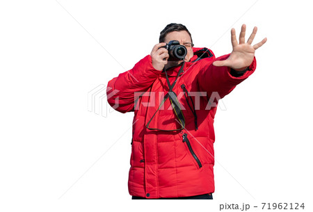 the guy takes photos and holds his hand in front of him 71962124