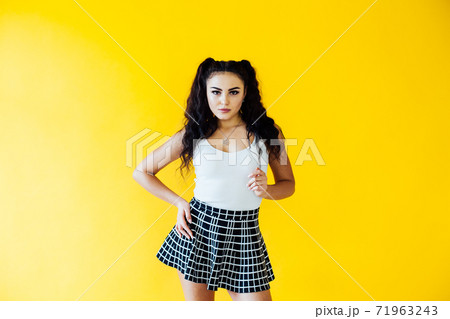 Portrait of a beautiful fashionable brunette woman in a white T-shirt 71963243