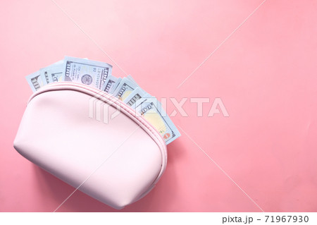 100 dollar cash in leather on pink background  71967930