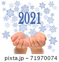 Flying snowflakes from woman’s cupped hands with 2021 text, Happy New year 2021, 2021 New Year greeting card, happiness luck health success concept, isolated on white background, 2021 greeting card co 71970074