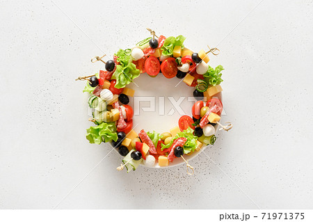 Christmas wreath of holiday snacks, canapes Christmas wreath of holiday snacks, canapes 71971375