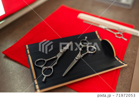 Hairdresser equipment, top view, red background Hairdresser equipment, top view, red background 71972053