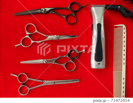 Hairdresser equipment, top view, red background Hairdresser equipment, top view, red background 71972054
