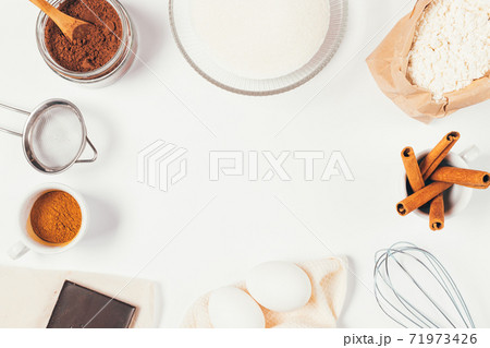 Flat lay bakery frame with ingredients and utensils for homemade brownie Flat lay bakery frame with ingredients and utensils for homemade brownie 71973426