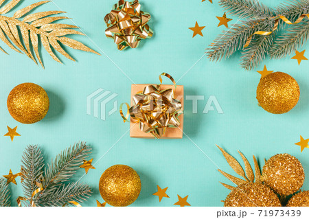 Christmas gift box among fir branches 71973439