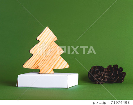 The new year concept as a background of the wooden conifer tree with strobiles. The new year concept as a background of the wooden conifer tree with strobiles. 71974498