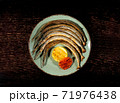 Grilled fish on a plate. Restaurant food. Fish dish with lemon. 71976438