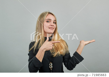 Shows direction of hands, demonstrates product, represents an imaginary output Shows direction of hands, demonstrates product, represents an imaginary output 71985663