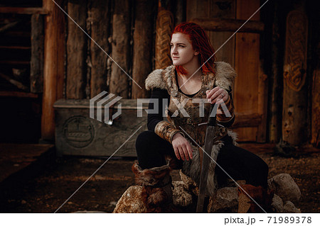 Viking girl. Reconstruction of a medieval scene Viking girl. Reconstruction of a medieval scene 71989378