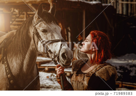 Viking girl. Reconstruction of a medieval scene Viking girl. Reconstruction of a medieval scene 71989383