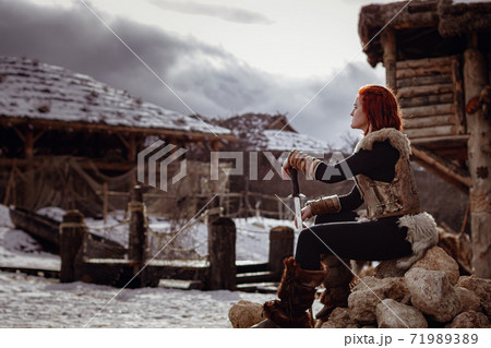 Viking girl. Reconstruction of a medieval scene Viking girl. Reconstruction of a medieval scene 71989389