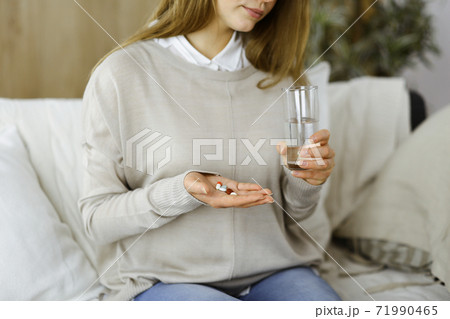 Beautician doing beauty procedure with syringe to face of young brunette woman in sunny spa center. Cosmetic medicine and surgery, beauty injections Beautician doing beauty procedure with syringe to face of young brunette woman in sunny spa center. Cosmetic medicine and surgery, beauty injections 71990465