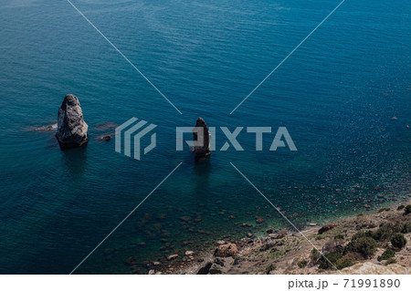 Beautiful view from the cliff on the blue sea. 71991890