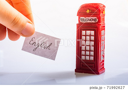 Notepaper with English wording near the telephone booth 71992627