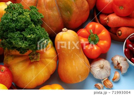 Beautiful assortment of colorful vegetables on blue background 71993004