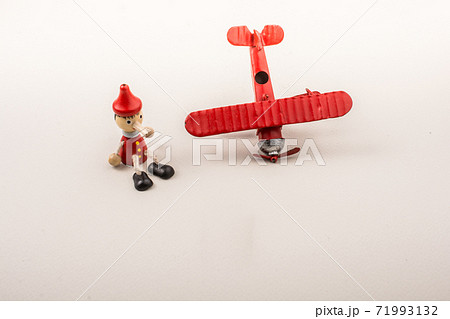 Airplane, Bullet and wooden pinocchio doll 71993132