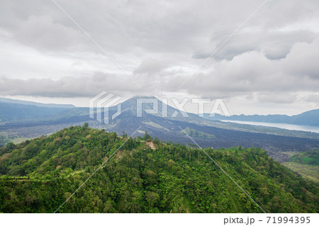 View of the volcano Batur and the jungle 71994395